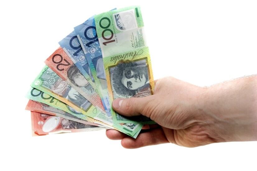 hand holding australian dollar money older australians abs retirement