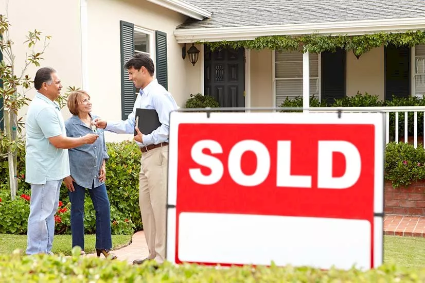 old couple sold sign house ne